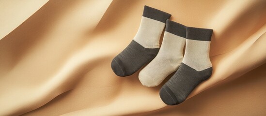Minimalist cotton sock with a subtle stripe pattern in neutral tones, displayed on a simple flat lay background