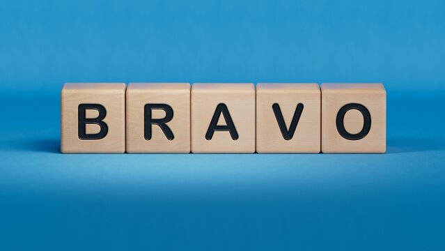 The word bravo appearing wooden cubes. Education concept.close up of wooden elements,Business Concept.3D rendering on blue background.