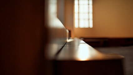 Obraz premium A wooden bench in a church. Bench window close up brown wooden glare. A wooden bench with a glare of brown glares. Lifestyle.
