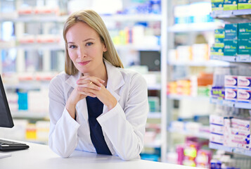 Confident, woman and portrait with pharmacist at dispensary for pharmaceutical, prescription and medication. Pharmacy, pride and medical worker at counter for customer service, healthcare and supply