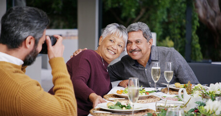 Senior, grandparents and family with food, picture or love with smile, Christmas or social gathering. Elderly, home or people with feast, healthy meal and photograph for happy memory or celebration