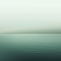 Fototapeta premium Serene Teal Sea Minimalist Ocean Landscape with Calm Water and Misty Sky - Stock Photo