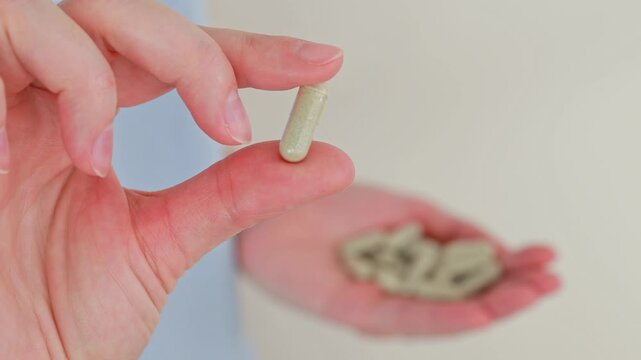 Close-up of an iron capsule. Medicines and dietary supplements