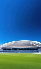 Obraz premium Modern Stadium Exterior with Clear Blue Sky and Lush Green Grass for Sports Event or Outdoor Activities
