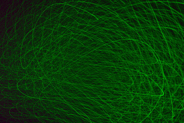 Background image of a light pattern of chaotic green laser lines
