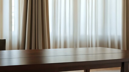 Fototapeta premium Wooden table in front of a blurred window with curtains, offering a warm and serene setting with a focus on the wood's natural beauty and the soft light coming through.
