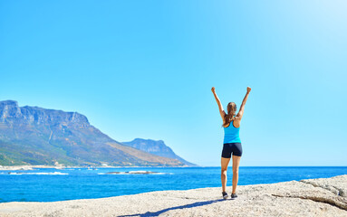 Fitness, freedom and girl on beach with achievement, space and outdoor training exercise. Ocean,...