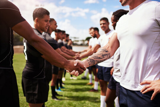 Rugby, team and handshake for welcome, introduction or sportsmanship on grass field outdoors. Sports, men shaking hands and greeting for game rival, competition or training with workout and exercise