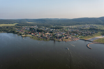 Southern Urals, Bashkortostan, the village of Nugush and the dam of the Nugush reservoir. Aerial view.