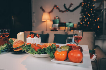 Happy multigeneration family enjoying in opening gifts on Christmas eve at home.