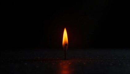 A small flame isolated on a black background with lower third exposure, effect, lighting, black