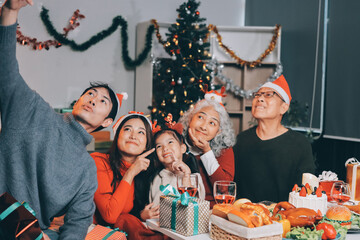 Happy family with gifts celebrating Christmas together