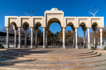 The arch adorning the entrance to the Samonids Recreation Park on a sunny day, Bukhara, Uzbekistan