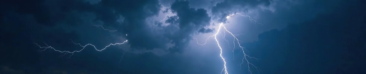 Heavy black clouds with brilliant white lightning illuminating the darkness of the sky, heavy clouds, brilliant white lightning