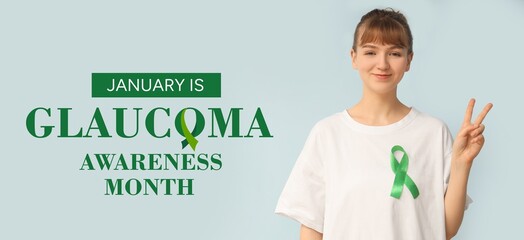 Young woman with green ribbon showing victory gesture on light background. Banner for Glaucoma...