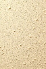 Cream-colored plaster wall with irregular texture, earthy, textured, irregular