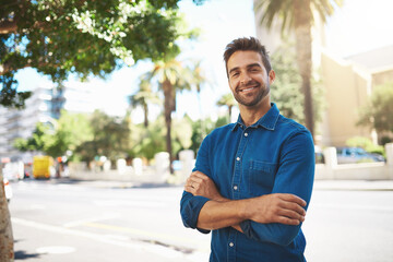 Happy man, portrait or trip with confidence in city for opportunity, travel or destination. Handsome, Italian or young male person with smile or arms crossed for commute in an urban town of Italy