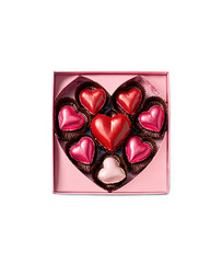 A box of heart-shaped chocolates and candies arranged in red cupcake liners. The assortment includes pink, white, and dark chocolate hearts, symbolizing love and sweetness.