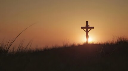 Silhouette of Jesus Christ on a cross at sunset
