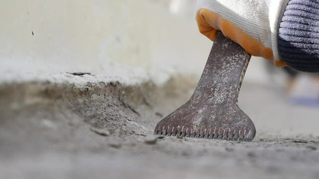 Close up of Concrete repair with chisel