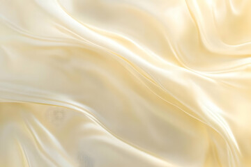 Fototapeta premium A smooth, flowing fabric in soft beige tones, showcasing elegant draping and texture.