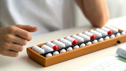 Boy doing mental arithmetic on the abacus