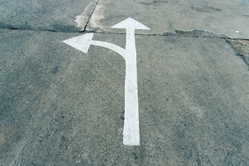 Arrow on the road and white color