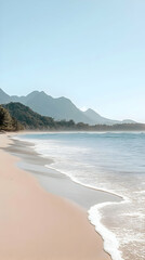 Serene beach scene with gentle waves and distant mountains under a clear sky.