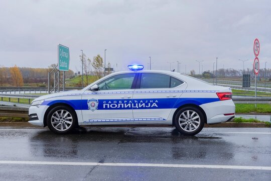 Serbian Police Car Parked on Highway with blue lights on