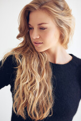 Naklejka premium Hair, woman and thinking for beauty, texture and growth with volume waves for wellness on white background. Haircare, highlights and hairstyle for natural cosmetics with thoughts for salon treatment