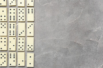 Many white dominos blocks on grey grunge background