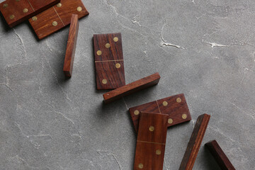 Wooden dominos blocks on grey grunge background
