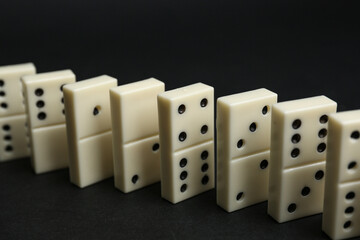 White dominos blocks on black background