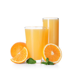 Glasses of tasty juice with oranges and mint leaves on white background