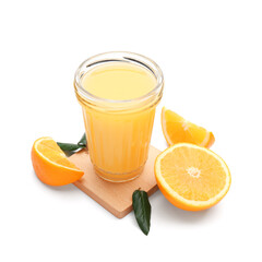 Glass of tasty juice with oranges and leaves on white background