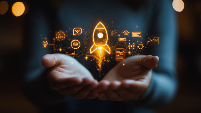 A person is holding a hand up to a rocket