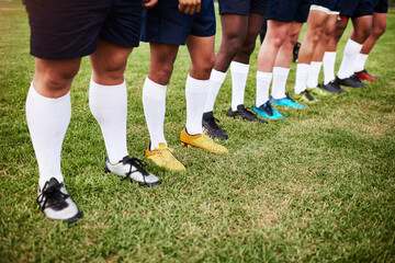 Fitness, grass and line with legs of rugby player team outdoor on field together for start of game. Exercise, solidarity and sports with athlete group in row at venue for competition or tournament