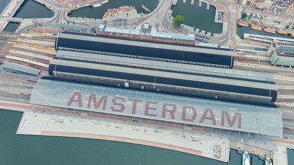 Amsterdam, Netherlands. Amsterdam Central Station. Amsterdam Centraal - The largest train station in the city, built in 1889. Bay IJ (Amsterdam), Aerial View