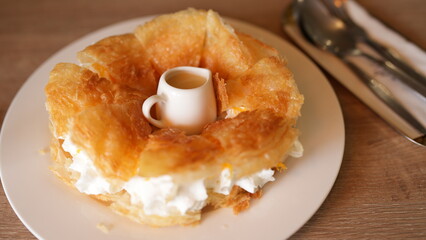 Flaky Pastry Dessert with Cream and Sauce Presentation on Plate