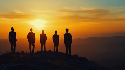 Fototapeta premium Silhouette of business team stand and feel happy on the most hight at stand on sunset, success, leader, teamwork, target, Aim, confident, achievement, goal, on plan, finish