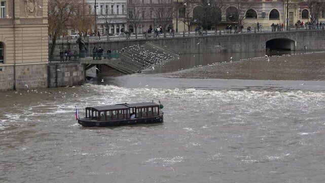 Tourist boat at the Moldau river in Prague