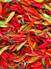 Piles of fresh tomatoes at a traditional market in Indonesia