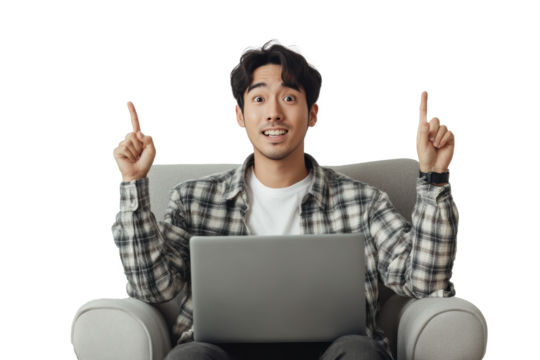 A man is sitting on a chair with a laptop in front of him