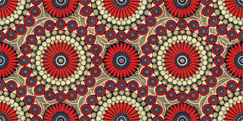 Vibrant circular pattern featuring red and gold hues with intricate design elements.