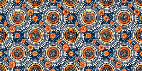 Fototapeta premium Colorful circular pattern featuring vibrant orange and white designs on blue background.