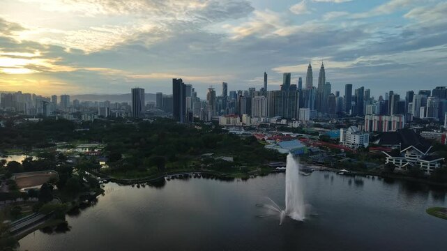 aerial view of kuala lumpur in the background with beautiful morning lark park scenery people jog