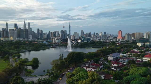 aerial view of kuala lumpur in the background with beautiful morning lark park scenery people jog