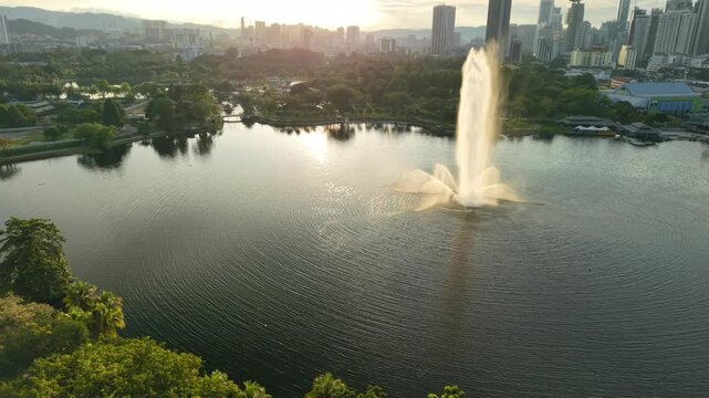 aerial view of kuala lumpur in the background with beautiful morning lark park scenery people jog