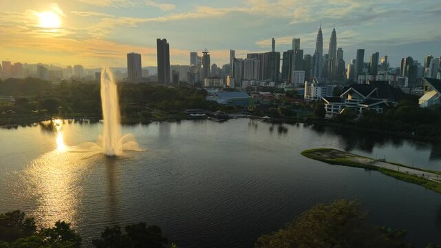 aerial view of kuala lumpur in the background with beautiful morning lark park scenery people jog