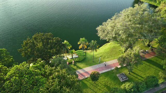 aerial view of kuala lumpur in the background with beautiful morning lark park scenery people jog